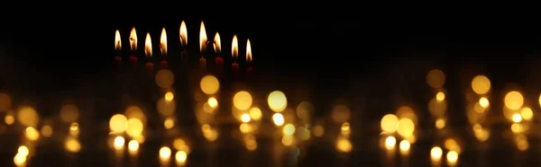 Low key image of jewish holiday Hanukkah background with burning candles — Stock Photo, Image