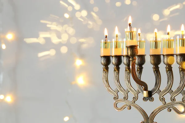 Image of jewish holiday Hanukkah background with menorah (traditional candelabra)