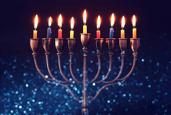 Jewish holiday Hanukkah background with menorah (traditional candelabra) and burning candles — Stock Photo, Image