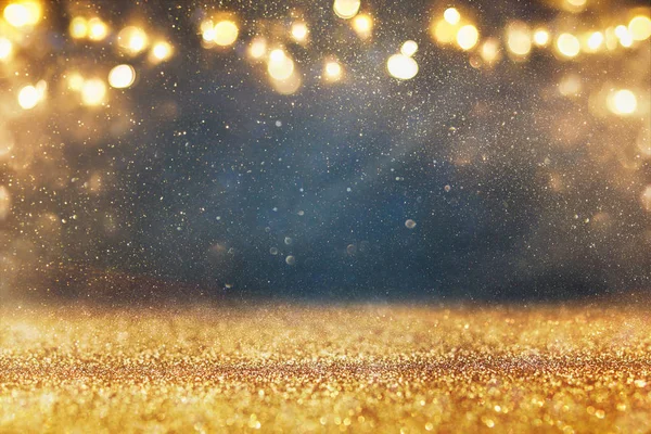 Glitter vintage lights background. gold and black. de focused — Stock Photo, Image