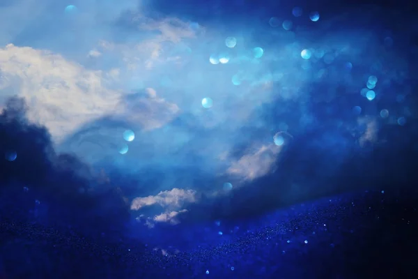 Abstract stormy sky with clouds. glitter lights background. blue, black and silver. de focused. — Stock Photo, Image