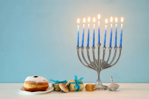 Image of jewish holiday Hanukkah background with traditional spinnig top, menorah (traditional candelabra) — Stock Photo, Image