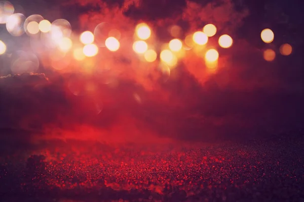 黒と赤はキラキラのライトの背景です。デフォーカス — ストック写真