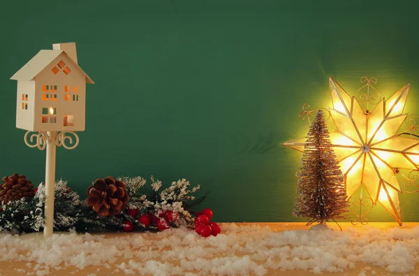 Image of christmas trees on snowy wooden table. — Stock Photo, Image