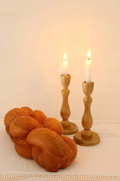 Shabbat image. challah bread, shabbat wine and candles on the table. — Stock Photo, Image