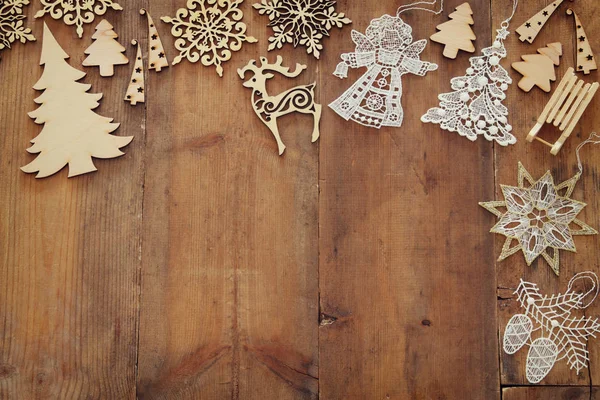 Top view image of christmas festive decorations on wooden background. Flat lay. — Stock Photo, Image