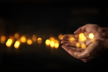 closeup hands of man begging for help. concept for poverty or hunger, seeking for light in the dark. clipart