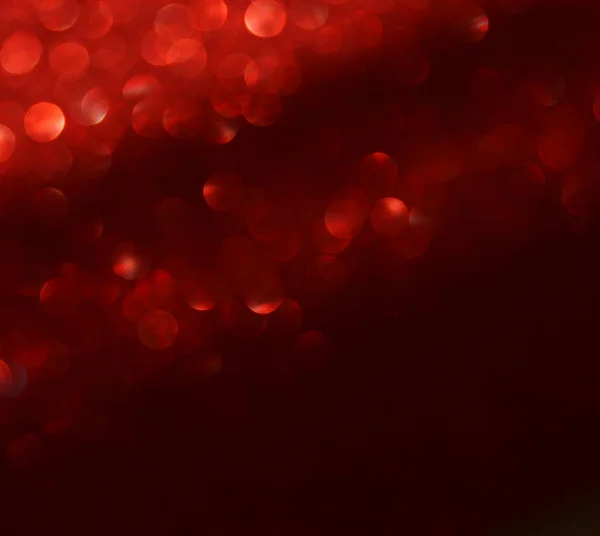 Black and red glitter lights background. defocused. — Stock Photo, Image