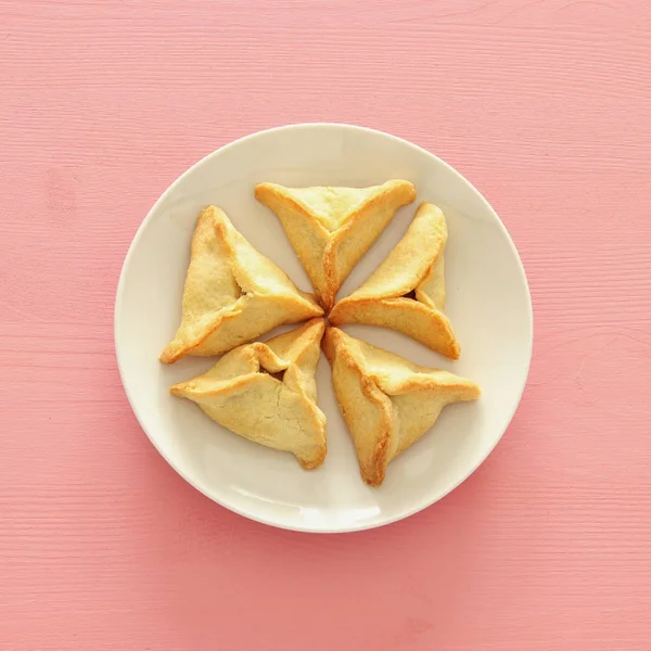 Purim viering concept (Joods carnaval vakantie). Traditionele hamantaschen cookies. Bovenaanzicht. — Stockfoto