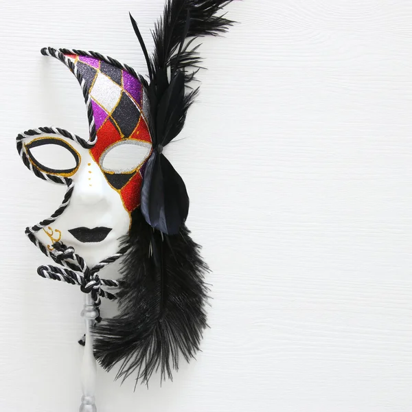 Top view image of dramatic masquerade venetian mask over white background. Flat lay. — Stock Photo, Image