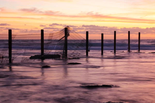 Háttér, a strand és a tenger a sunset színek. — Stock Fotó