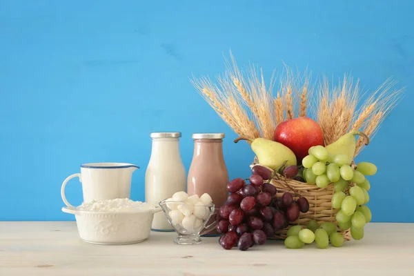 Image of dairy products and fruits over wooden table. Symbols of jewish holiday - Shavuot. — Stock Photo, Image