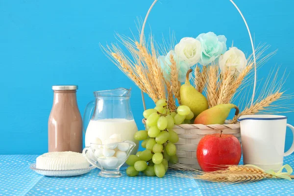 Image of dairy products and fruits over wooden background. Symbols of jewish holiday - Shavuot. — Stock Photo, Image