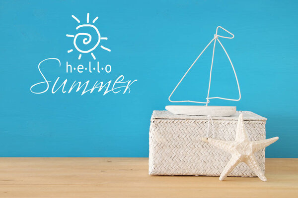 nautical, vacation and travel image with sea life style objects over wooden table.