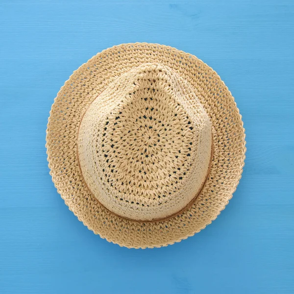 Vacation and summer image with fedora beach hat over blue wooden background. — Stock Photo, Image