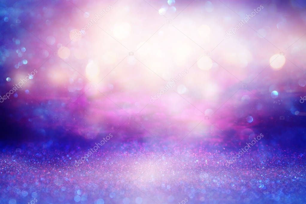 glitter vintage lights background. pink and purple. de-focused.