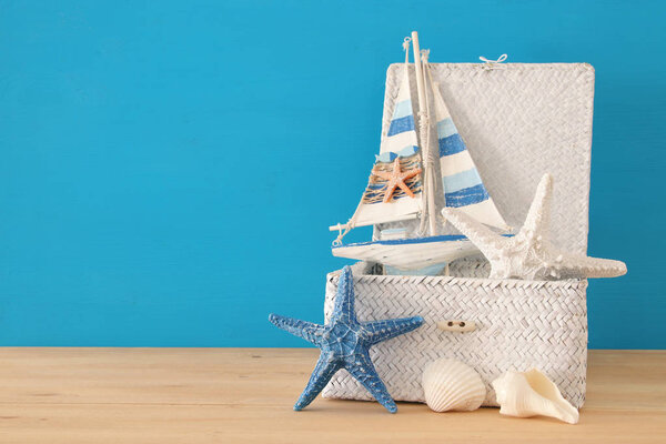 nautical, vacation and travel image with sea life style objects over wooden table.