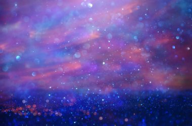 Glitter vintage ışıklar arka plan. pembe ve mor. de-odaklı.