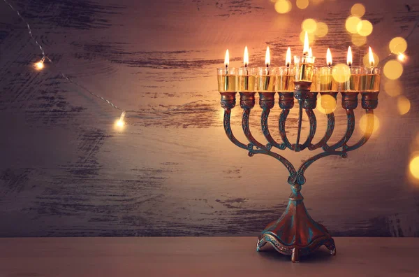 Religion image of jewish holiday Hanukkah background with menorah (traditional candelabra) and candles