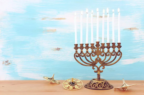 Religion image of jewish holiday Hanukkah background with menorah (traditional candelabra) and dreidels — ストック写真