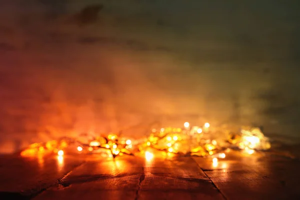 Background image of abstract blurred gold garland lights. defocused — Stock Photo, Image