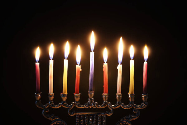 Religion image of jewish holiday Hanukkah background with menorah (traditional candelabra) and candles
