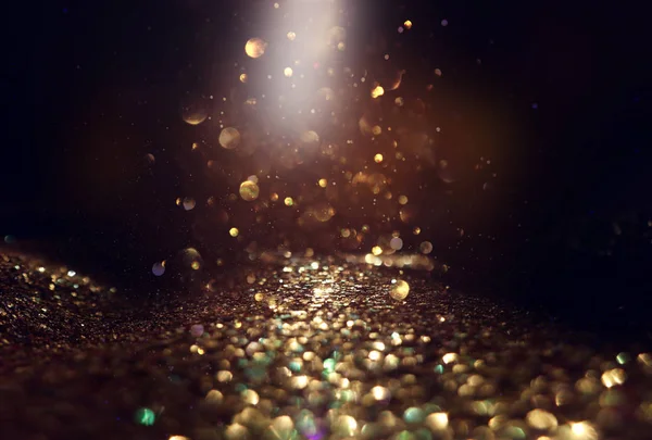 Bakgrund av abstrakta glitter ljus. guld och svart. de fokuserade — Stockfoto