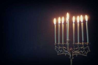 Religion image of jewish holiday Hanukkah background with menorah (traditional candelabra) and candles clipart