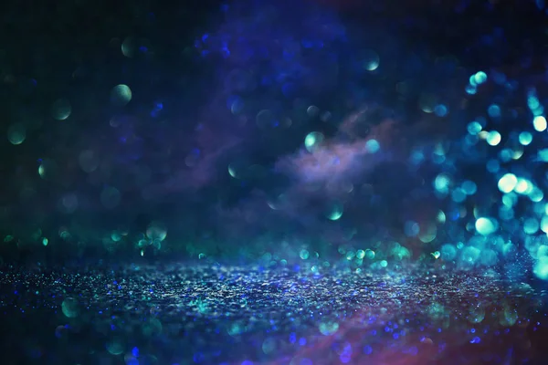 Abstract glitter black and blue lights background. de-focused — Stock Photo, Image