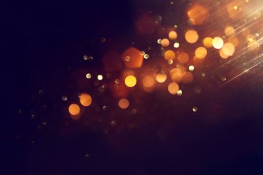 soyut glitter ışıkları arka plan. altın ve siyah. de odaklı