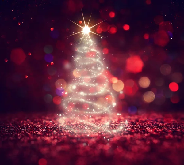 Background of Christmas tree with defocused glitter lights — Stockfoto