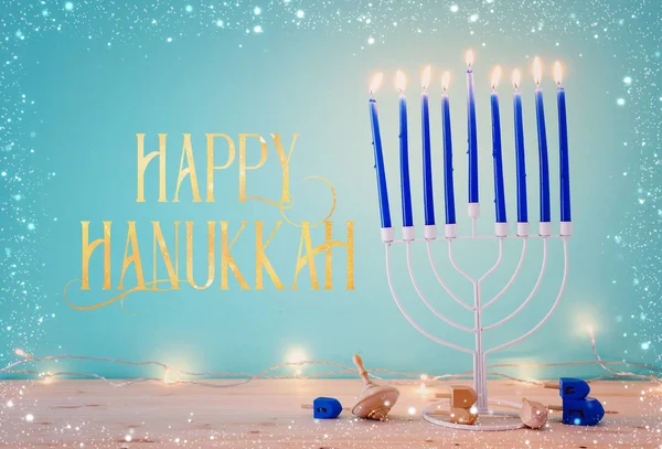 Religion image of jewish holiday Hanukkah background with menorah (traditional candelabra) and dreidels — ストック写真