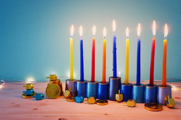 Religion image of jewish holiday Hanukkah background with menorah (traditional candelabra) and spinning top — Stock Photo, Image