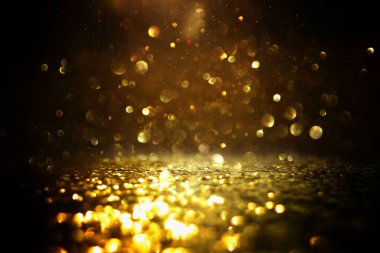 soyut glitter ışıkları arka plan. altın ve siyah. de odaklı