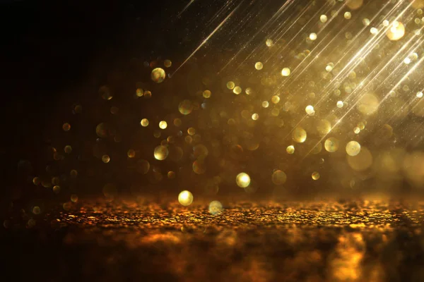 Sfondo di luci glitter astratte. oro e nero. de focalizzata — Foto Stock