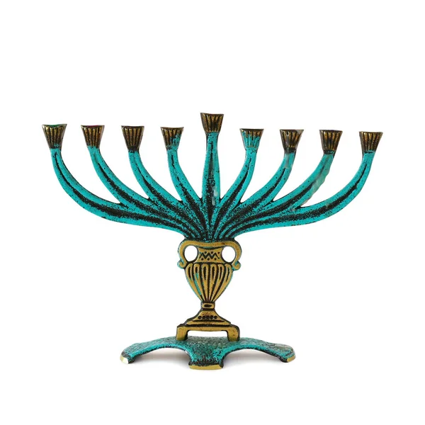 Religion image of jewish holiday Hanukkah with brass menorah (traditional candelabra) isolated over white background — Stock Photo, Image