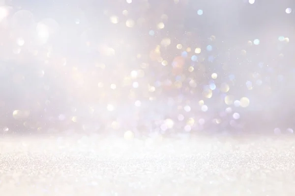 Abstract background of glitter vintage lights . silver, gold and white. de-focused — Stock Photo, Image