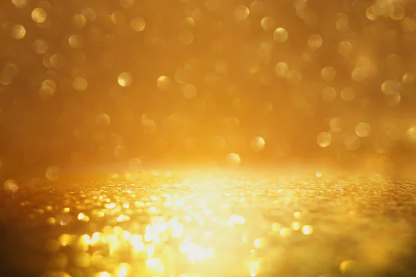 Background of abstract glitter lights. gold. de focused — Stock Photo, Image