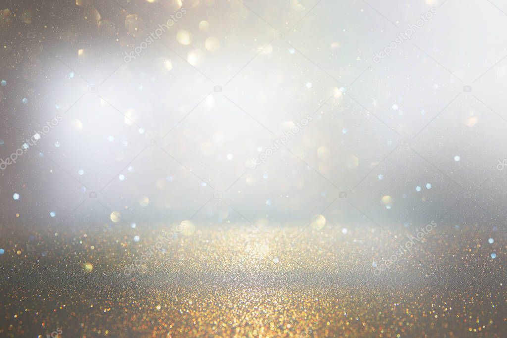 abstract background of glitter vintage lights . silver, gold and gray. de-focused