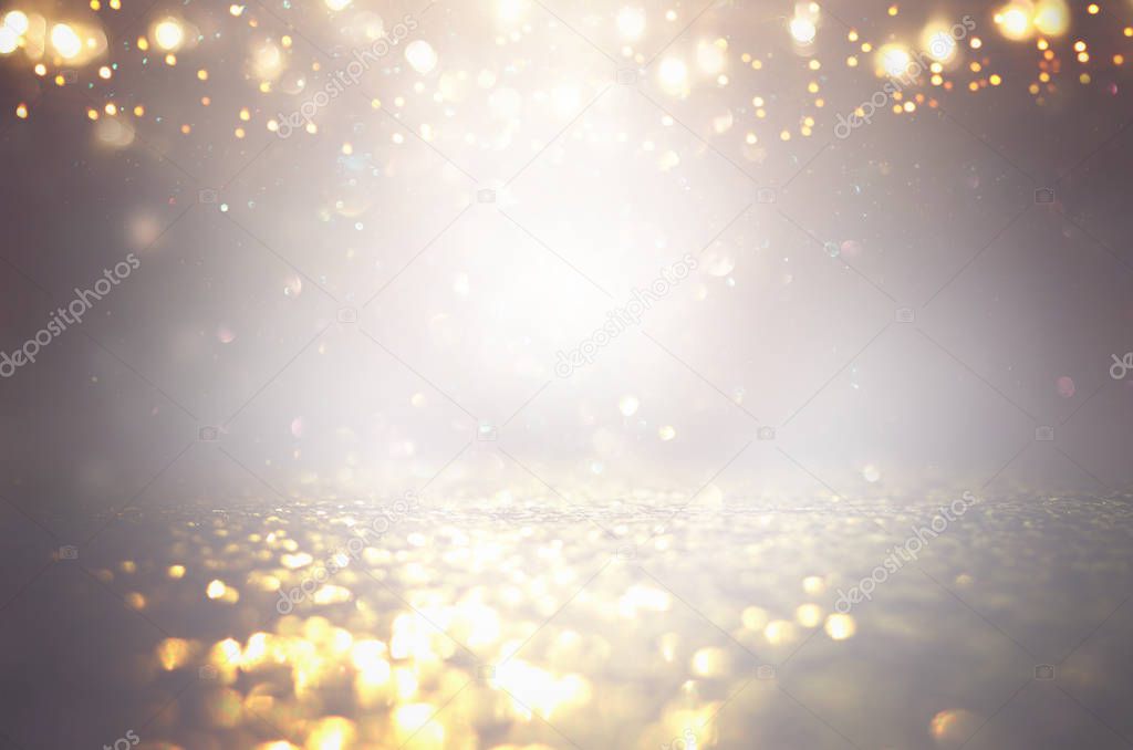 abstract background of glitter vintage lights . silver, gold and gray. de-focused