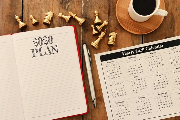 Business concept of top view 2020 plan list with notebook, cup o — Stock Photo, Image