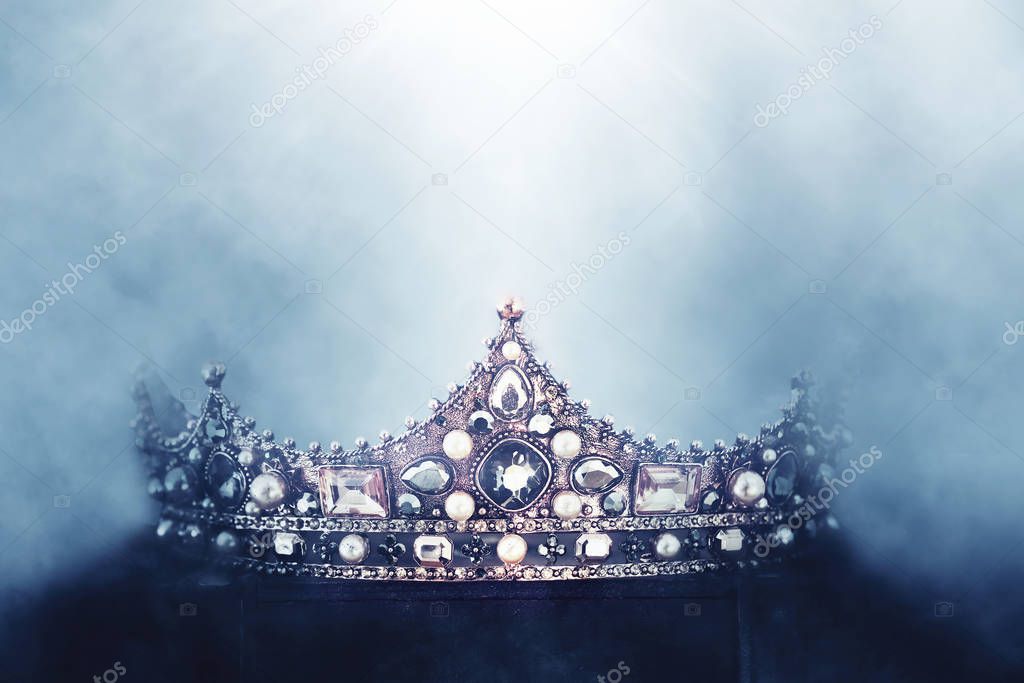 mysterious and magical photo of of beautiful queen/king crown over gothic dark background. Medieval period concept