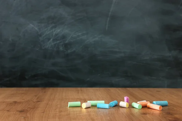 Education image - empty table and blackboard — Stock Photo, Image