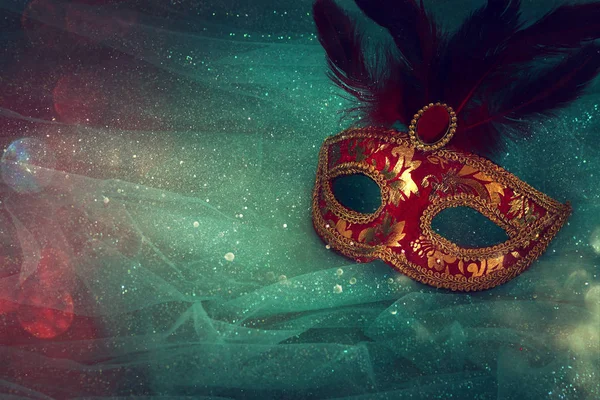 Photo of elegant and delicate red with gold Venetian mask over mint chiffon background — Stock Photo, Image