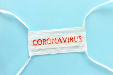Yüz maskesi üzerine yazılmış Coronavirus tıbbi konsepti. Sağlık ve tıbbi konsept