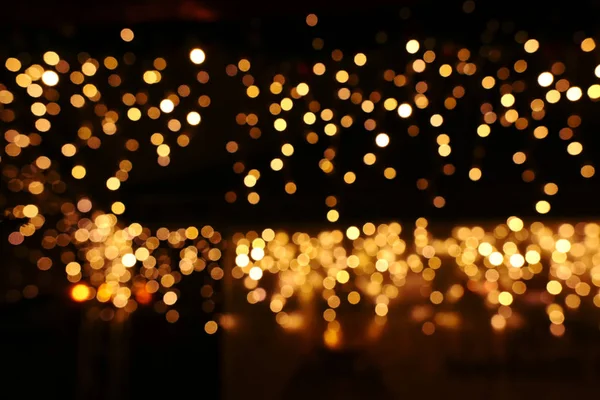 Background of abstract glitter lights. gold and black. de focused — Stock Photo, Image