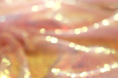 Bokeh ve güzel altın pulların soyut arkaplanı