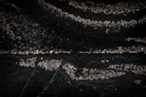 background of beautiful black sequins fabric