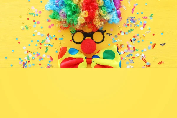 Carnival, party and Purim celebration concept (jewish carnival holiday) over yellow background — Stock Photo, Image