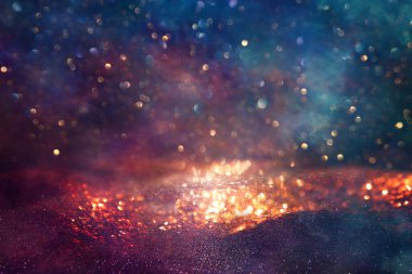 Soyut parıltılı ışıkların arkaplanı. Altın, mavi ve siyah. & Odaklan